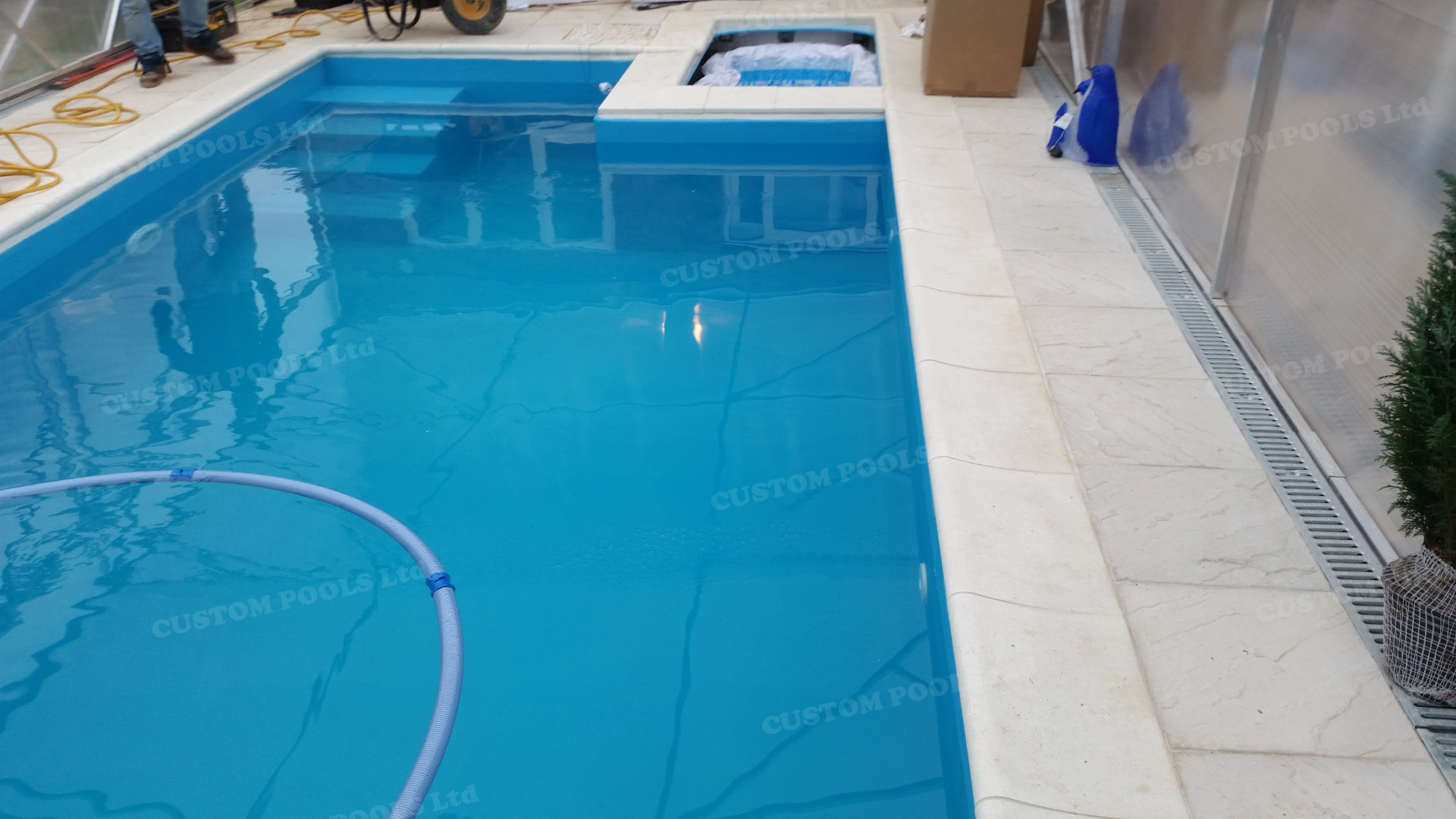Made to order swimming pool with waterfall